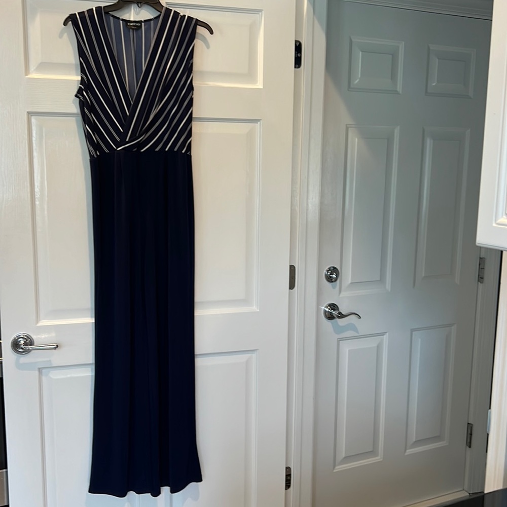 Navy blue jumpsuit with white stripe top part. Stretchy & very comfy.